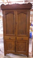 Primitive carved oak blind door kitchen cupboard,