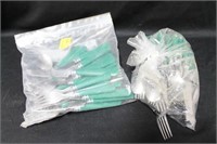 SET OF GREEN HANDLED STAINLESS FLATWARE