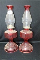 PAIR OF RED OIL LAMPS WITH CHIMNEYS