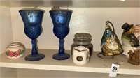Shelf lot of cobalt blue glasses, candleholders,