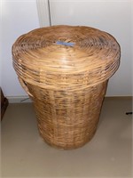 Wicker laundry basket with decorations inside