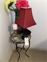 Night table with lamp, candle, vase, alarm clock