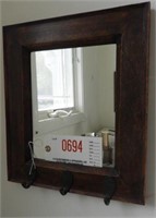 Lot #694 - Small wooden framed wall mirror with
