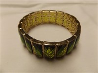 Green and gold costume stretch bracelet.