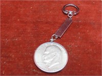 1976 Eisenhower Dollar US coin keychain.