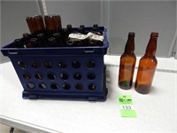 24- 22 oz. Bottles for craft beer in a plastic cra