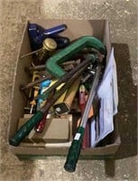 Box of tools includes clamps, a small hammer,