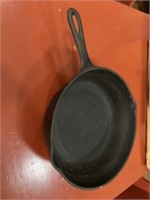 9 inch cast-iron skillet 3 inches deep. No name.