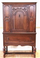 1920s Jacobean oak 1 door blind china cabinet