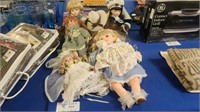 SIX VINTAGE PORCELAIN DOLLS