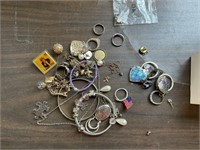 Small box of jewelry and pins