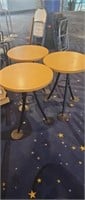 Three round cafeteria tables