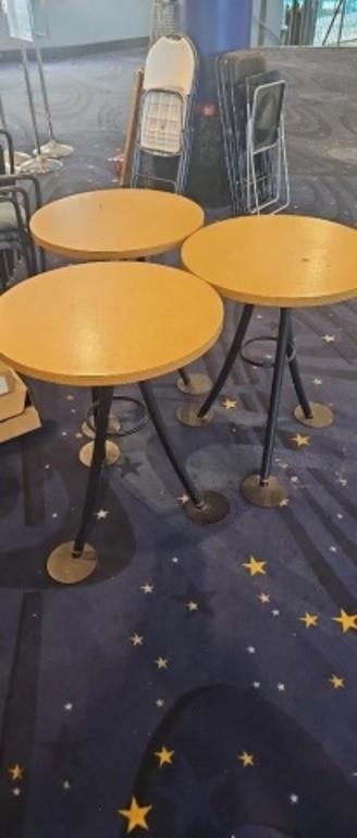 Three round cafeteria tables