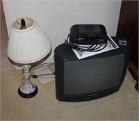 Pile TV, Clock Radio and Lamp