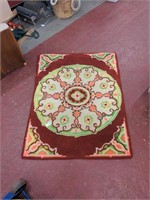 Red and green rug 34" x 45"
