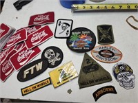Collection of sew on Coke/biker/military patches.