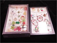 Two containers of Christmas jewelry including