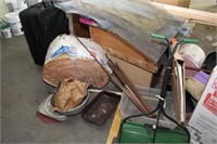 Pile of items in garage on floor around water