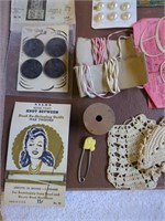 Vintage sewing needles, buttons, embroidered