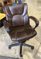 Five legged brown vinyl office chair with