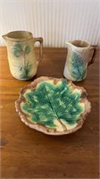 Three pieces of antique majolica ,  two creamers