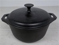 Cast iron pot with trays and lid.