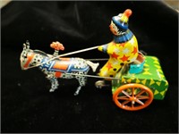Vintage tin litho wind-up circus clown driving