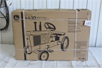 JD 4430 pedal tractor (still in box)
