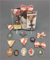 12 medals/ lapel pins: Red Cross, largely WWI.