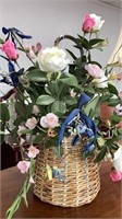 Everlasting flower arrangement in woven basket,