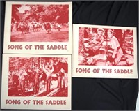 Three original "Song of the Saddle" lobby cards