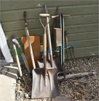 Group of antique shovels, scales, planters