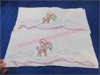 pair of old embroidered pillow slips (basket)