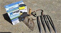 Garden supplies. Pick fork end, hoe end, garden