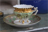 ORNATE GOLD TRIMMED PORCELAIN CUP & SAUCER