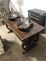 Custom wagon wheel double sink with copper sinks