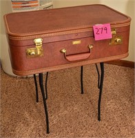 Brown hard cover suitcase table