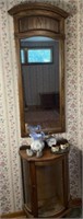 Curio cabinet, mirror, and decor