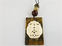 Lovely pendant set on jade of a bone rabbit, with