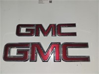 two GMC signs