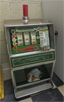 Jennings 25 cent slot machine. Note: Lights up.
