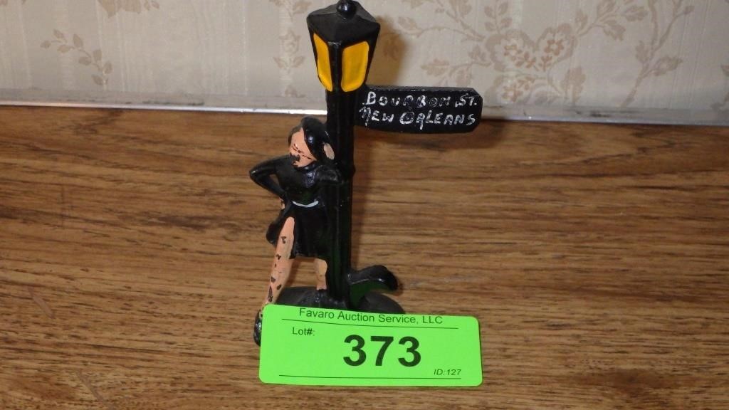 VINTAGE CAST IRON LADY ON LAMP POST BOTTLE OPENER>