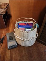 Woven basket with books, also vcr rewinder