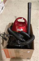 Small Coleman brand vacuum cleaner with
