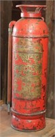 Badger's copper fire extinguisher with peeling red