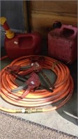 25 foot long orange air or gas hose with two 1