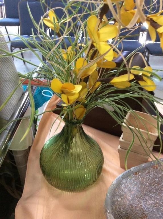 Green glass vase with flowers