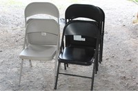 Two Gray & Seven Black Folding Chairs