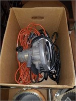 Box of extension cords and saw