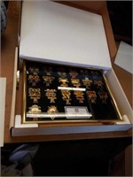 Box of Super Bowl commemorative pins